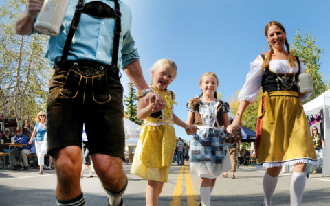 Oktoberfest Family in authentic Bavarian clothing, German Dirndl and Lederhosen